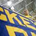 Michigan senior Kenrick Aylesworth hangs the band sign at Yost Ice arena on Tuesday. Daniel Brenner I AnnArbor.com